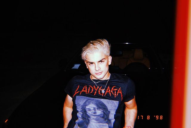 Diego is wearing a black tee.